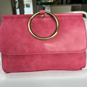NWT Pink crossbody with interchangeable strap
Aria Ring Bag
